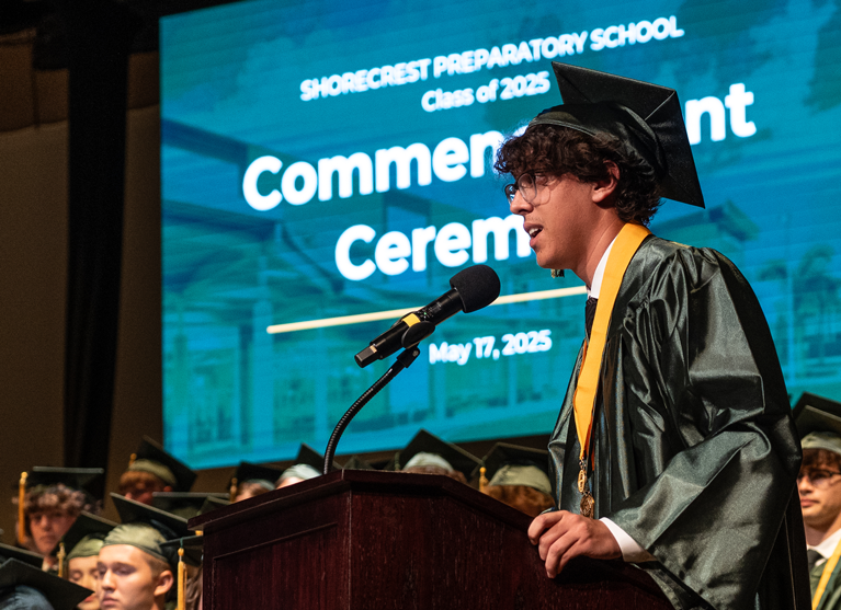 Max speaking at Commencement