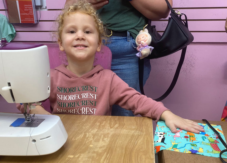 preschool students sewing